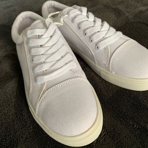 white lace-up canvas sneaker